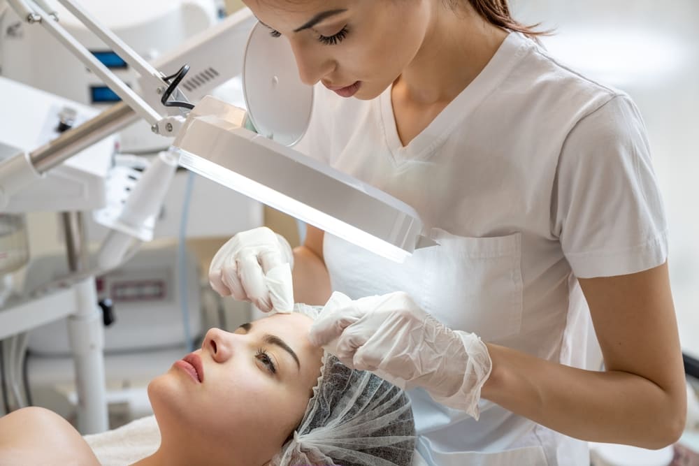 Forehead Acne treatment being done